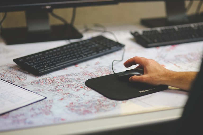 Man using a wired mouse and keyboard