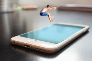 Edited photo of man diving in a pool graphic on an iPhone