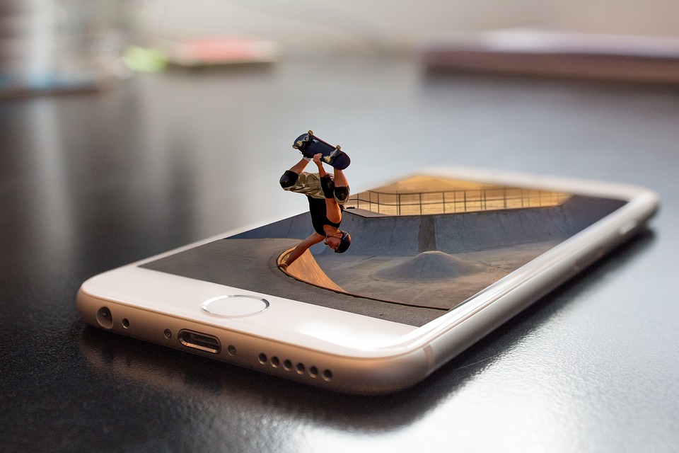 Photoshopped photo of an iPhone and a skater at a vert ramp